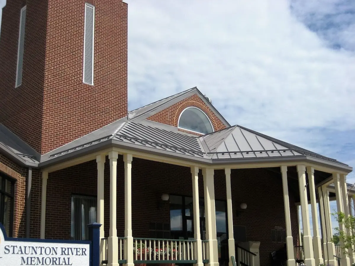 Skilled roofing craftsmen working on a residential roof in West Alexandria